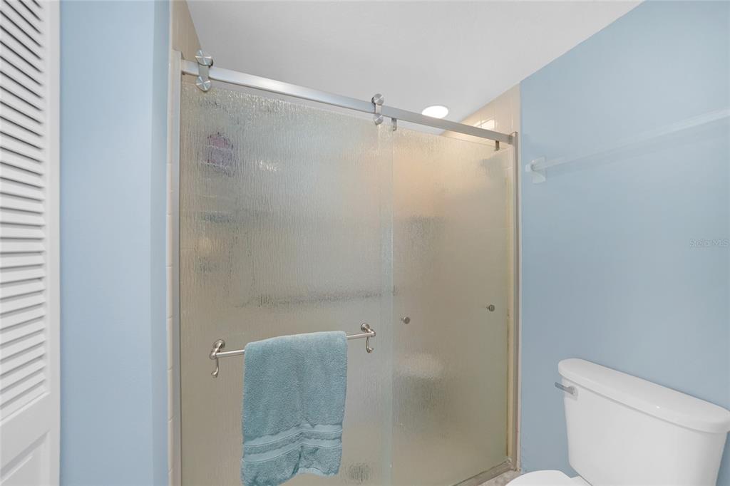 240 Lewis Circle, Unit 513 Punta Gorda, FL 33950 - Photo 19 of 45 a bathroom with a shower and a toilet