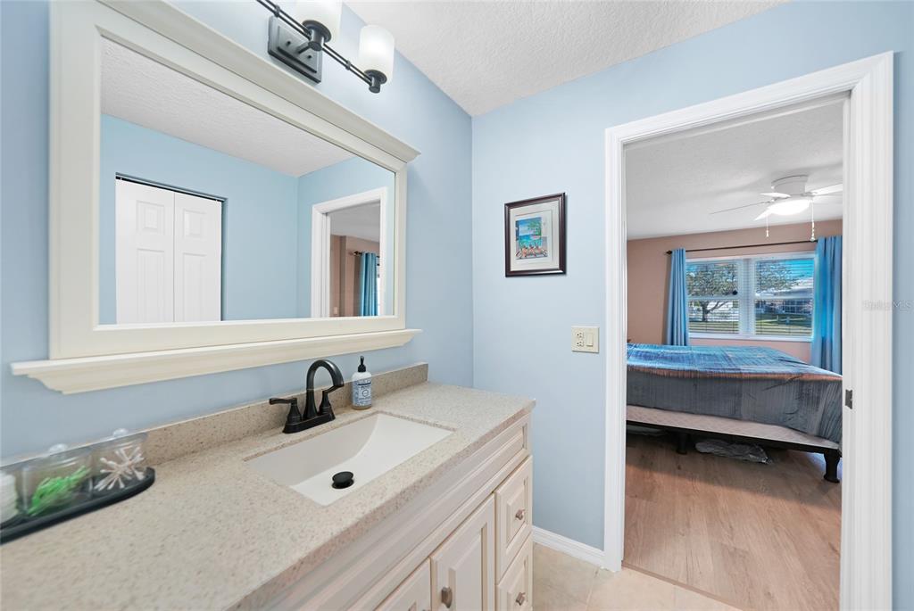 240 Lewis Circle, Unit 513 Punta Gorda, FL 33950 - Photo 20 of 45 a bathroom with a sink and a mirror
