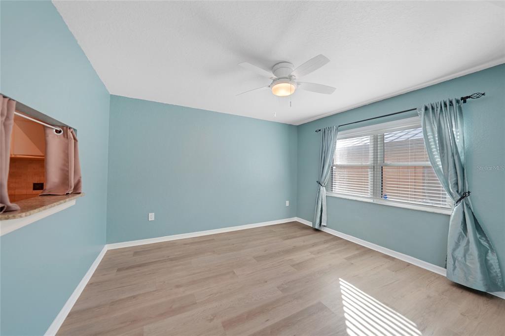 240 Lewis Circle, Unit 513 Punta Gorda, FL 33950 - Photo 25 of 45 a view of empty room with wooden floor and fan