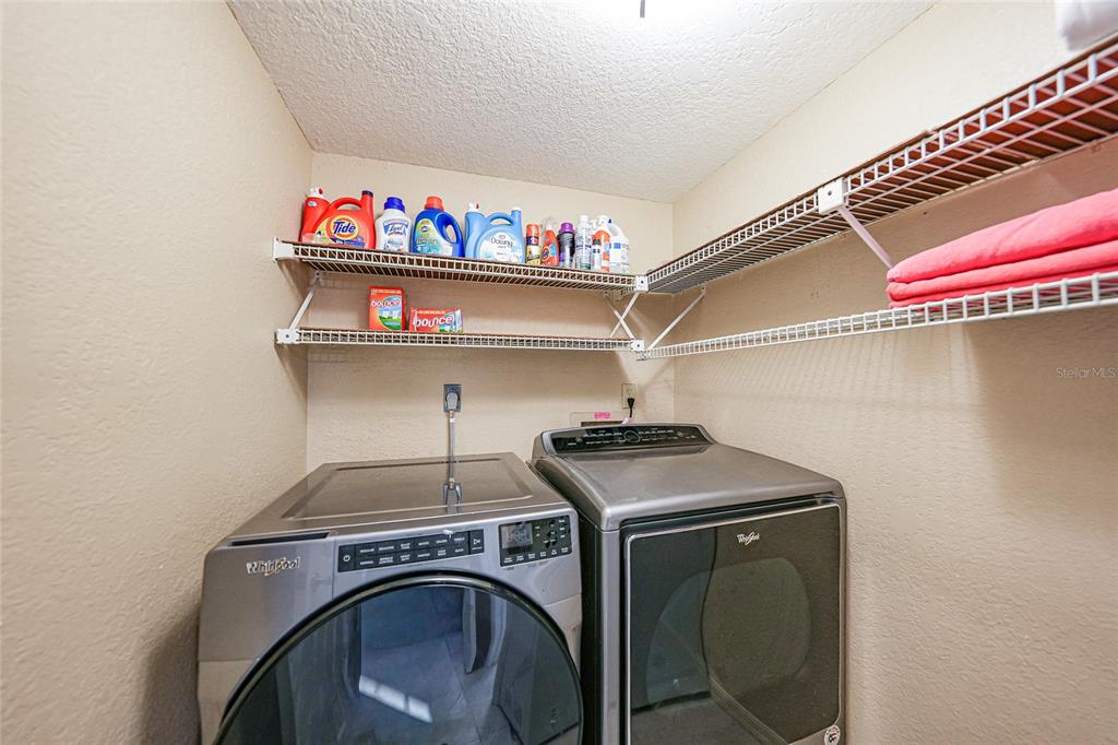 240 Lewis Circle, Unit 513 Punta Gorda, FL 33950 - Photo 27 of 45 a utility room with dryer and washer