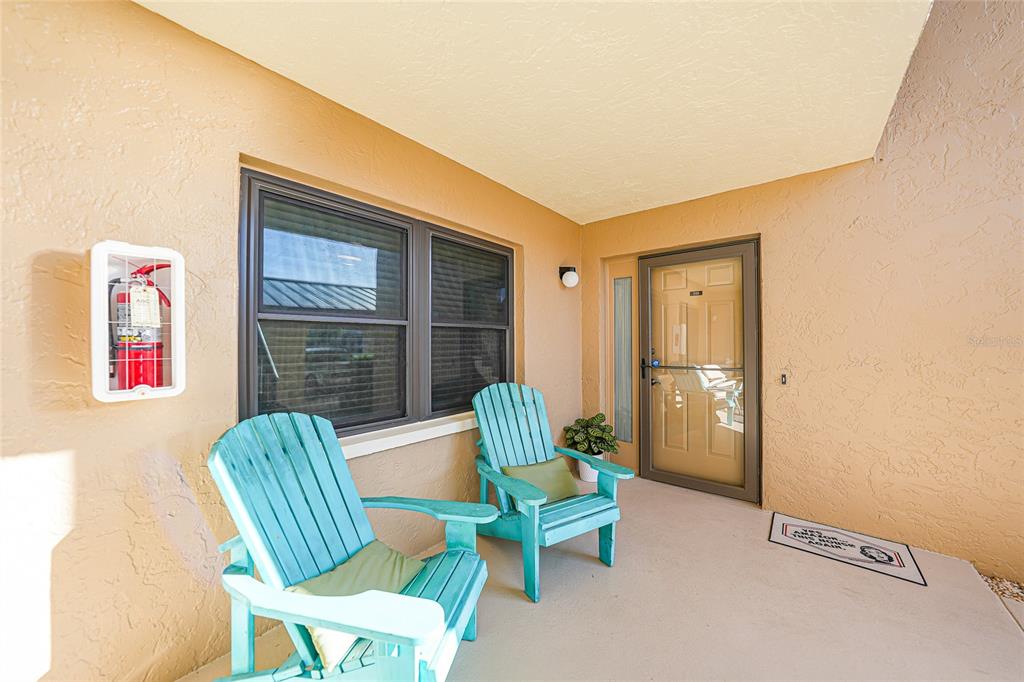 240 Lewis Circle, Unit 513 Punta Gorda, FL 33950 - Photo 4 of 45 a living room with furniture and a window