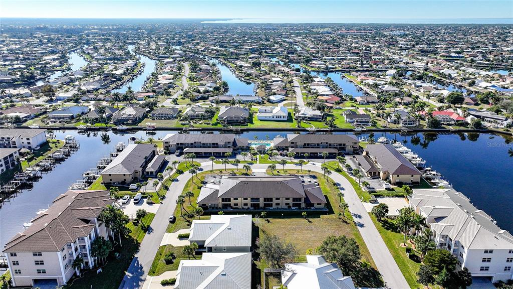 240 Lewis Circle, Unit 513 Punta Gorda, FL 33950 - Photo 42 of 45 an aerial view of a house with a swimming pool