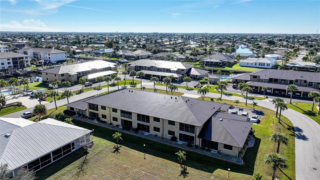 240 Lewis Circle, Unit 513 Punta Gorda, FL 33950 - Photo 43 of 45 an aerial view of a house with a swimming pool and outdoor seating