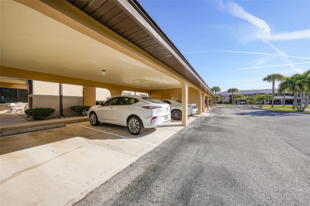 240 Lewis Circle, Unit 513 Punta Gorda, FL 33950 - Photo 45 of 45 a view of a car parked in front of a building