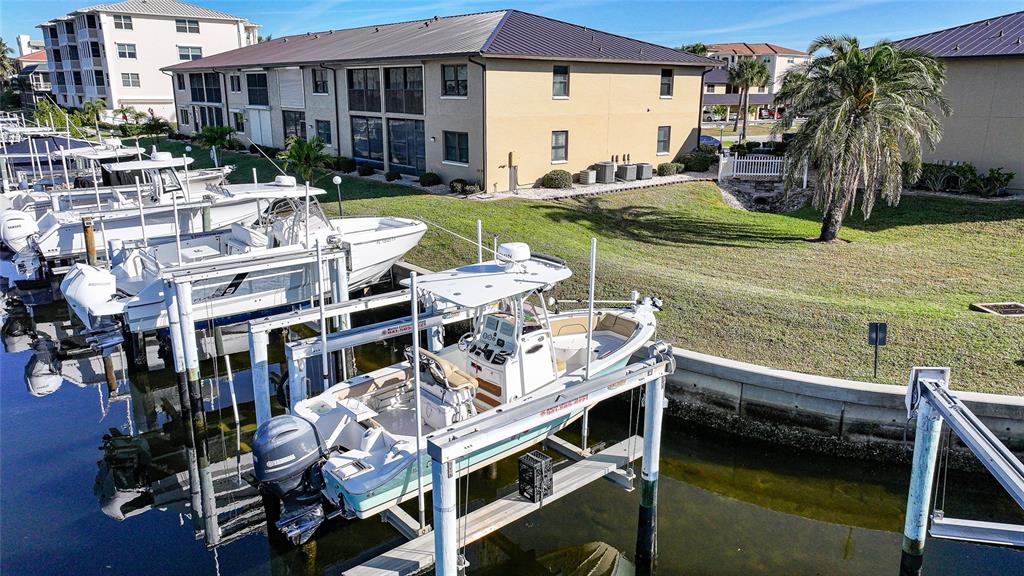 240 Lewis Circle, Unit 513 Punta Gorda, FL 33950 - Photo 5 of 45 a view of house with swimming pool and outdoor seating