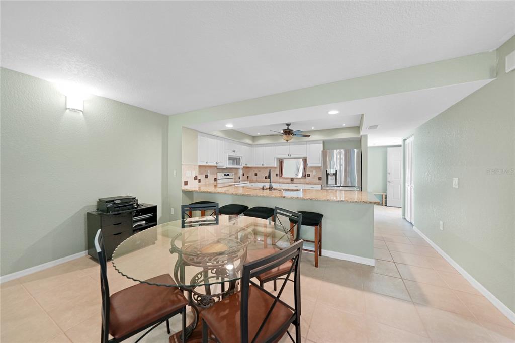240 Lewis Circle, Unit 513 Punta Gorda, FL 33950 - Photo 10 of 45 a view of a dining room with furniture and wooden floor