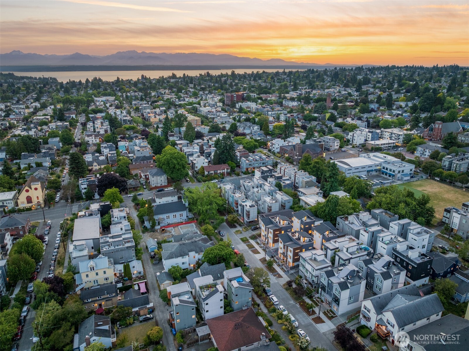 1748 Northwest 62nd Street Seattle, WA 98107 - Photo 15 of 33 an aerial view of a city with lots of residential buildings and ocean view in back
