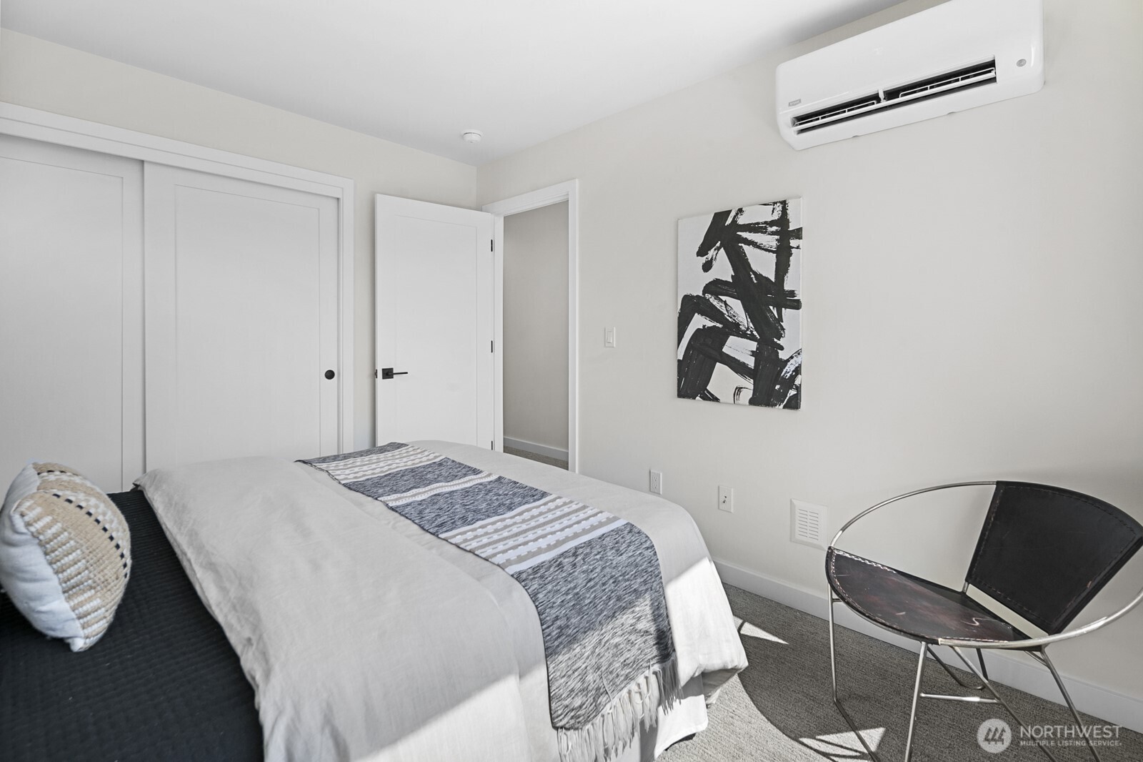 1748 Northwest 62nd Street Seattle, WA 98107 - Photo 20 of 33 a bedroom with a bed and a chair in it