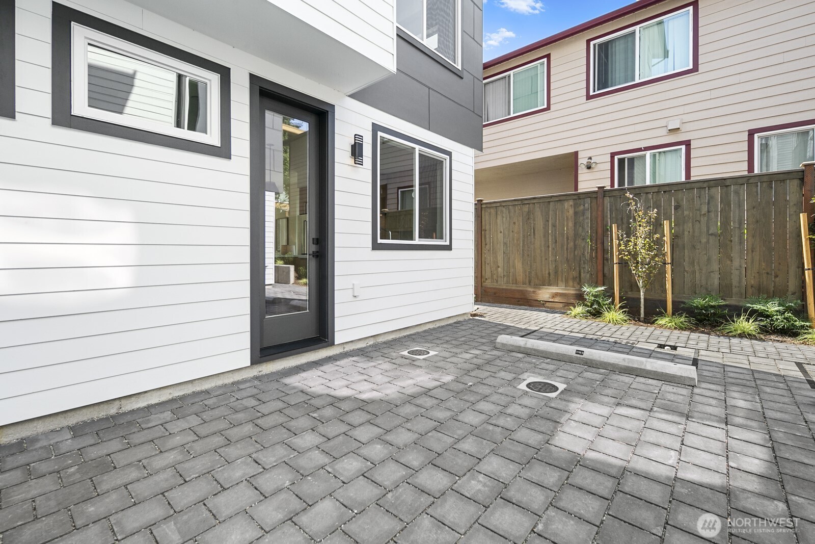 1748 Northwest 62nd Street Seattle, WA 98107 - Photo 27 of 33 a view of a house with backyard and parking space