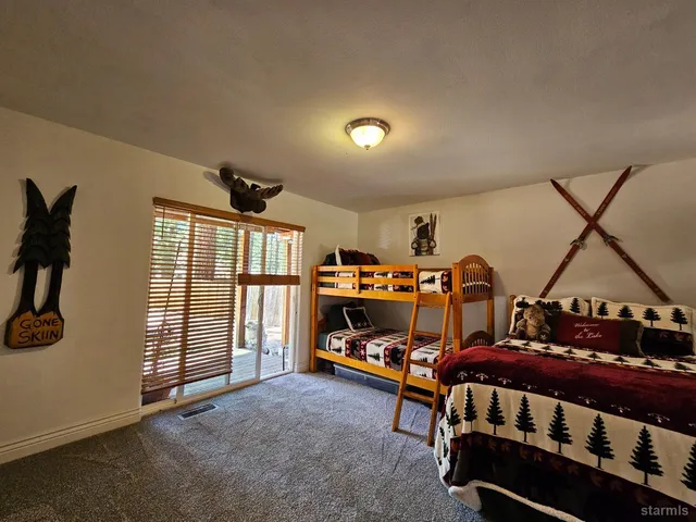 a bedroom with furniture and a window