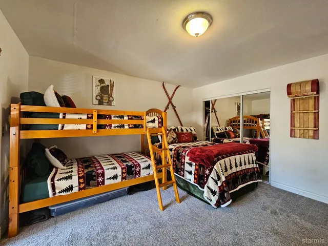 a bedroom with bed and window