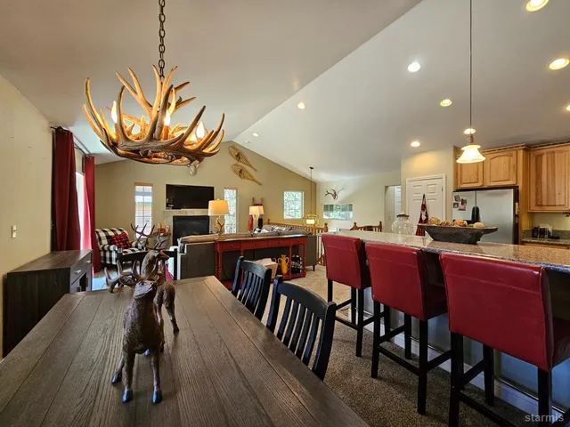 a view of a dining area with furniture and window