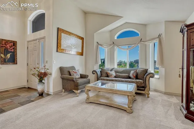 a view of a dining room with furniture large window and wooden floor