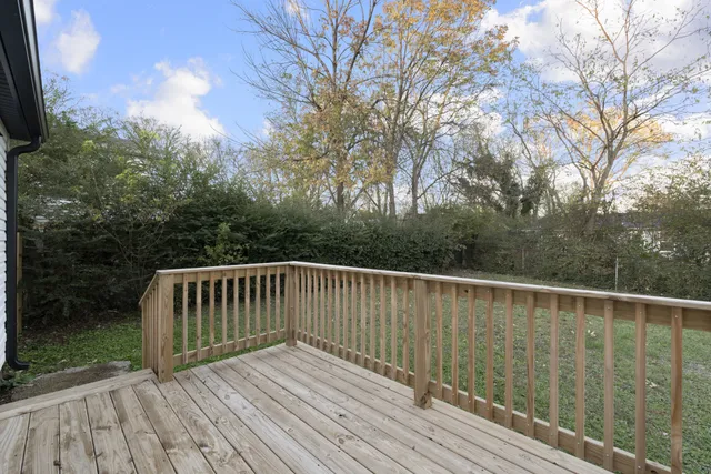 a deck with trees in front of it