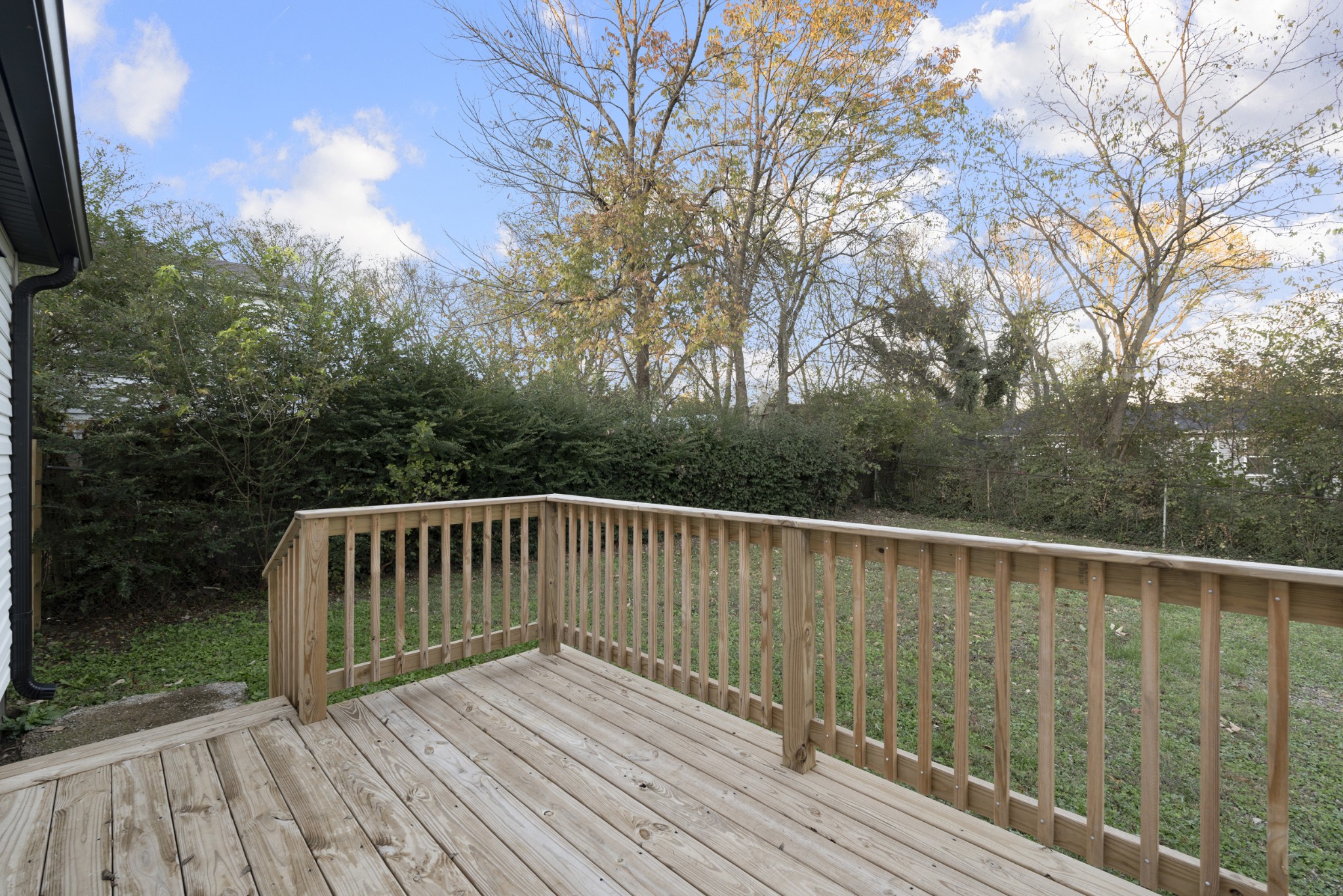 1021 Mallow Drive Madison, TN 37115 - Photo 12 of 13 a deck with trees in front of it