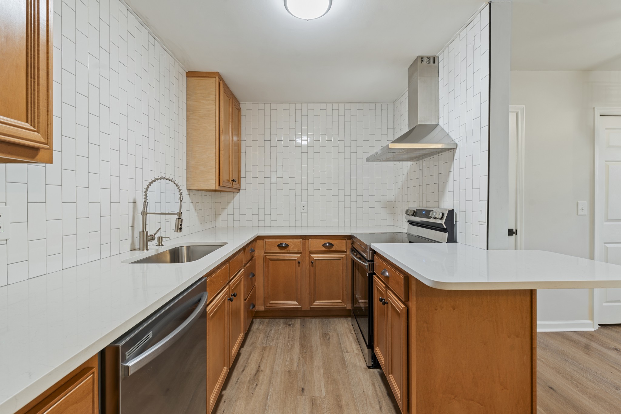 1021 Mallow Drive Madison, TN 37115 - Photo 5 of 13 a kitchen with a sink stove and cabinets