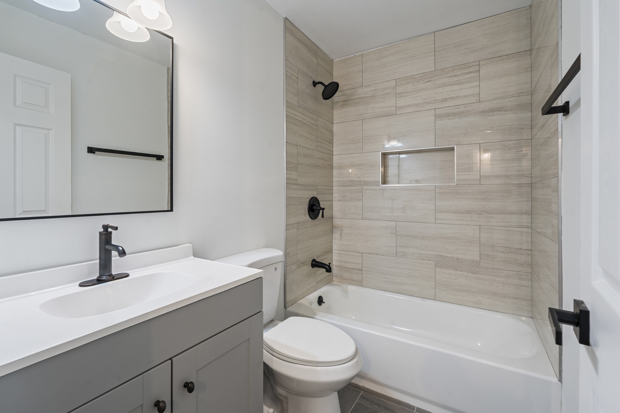 1021 Mallow Drive Madison, TN 37115 - Photo 7 of 13 a bathroom with a sink a toilet and shower