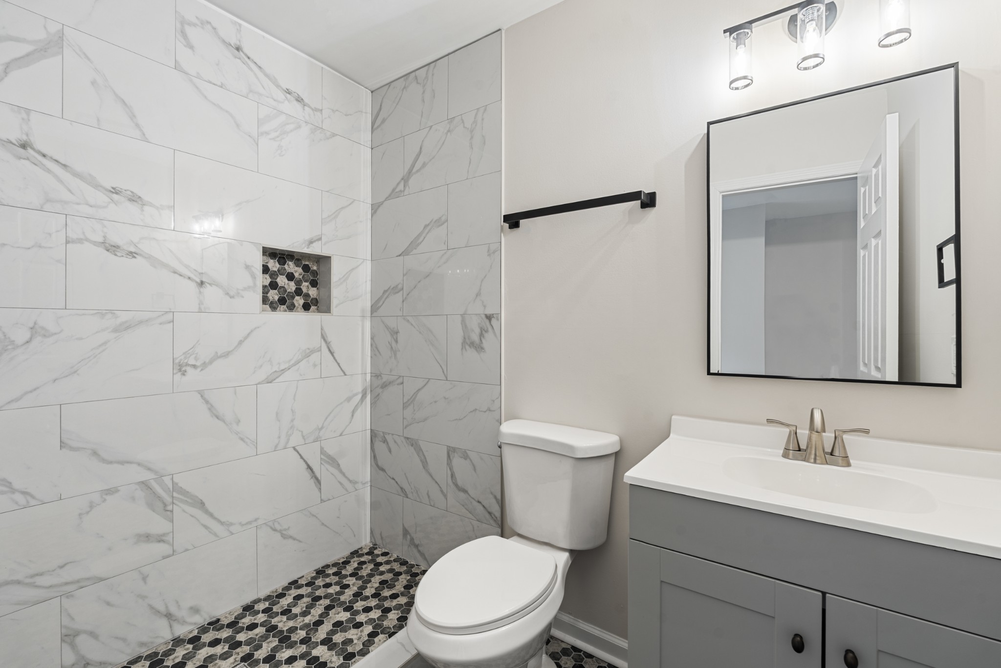 1021 Mallow Drive Madison, TN 37115 - Photo 10 of 13 a bathroom with a sink toilet and shower