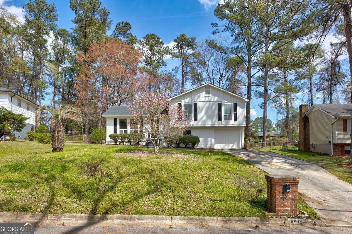 a front view of a house with a yard
