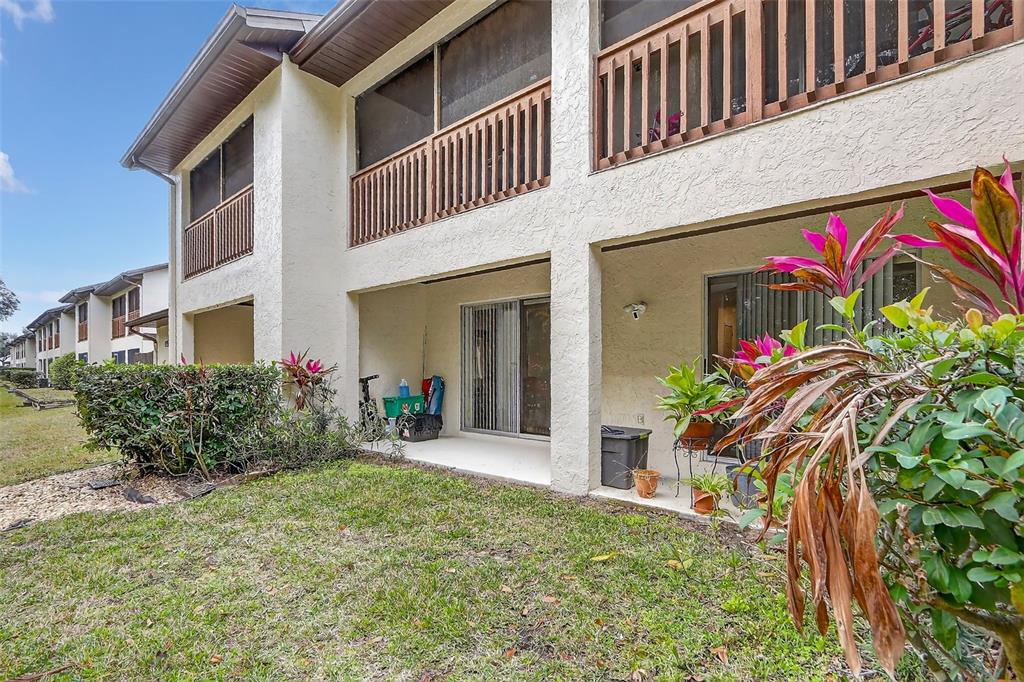 600 Northern Way, Unit 303 Winter Springs, FL 32708 - Photo 20 of 25 front view of a house with a yard