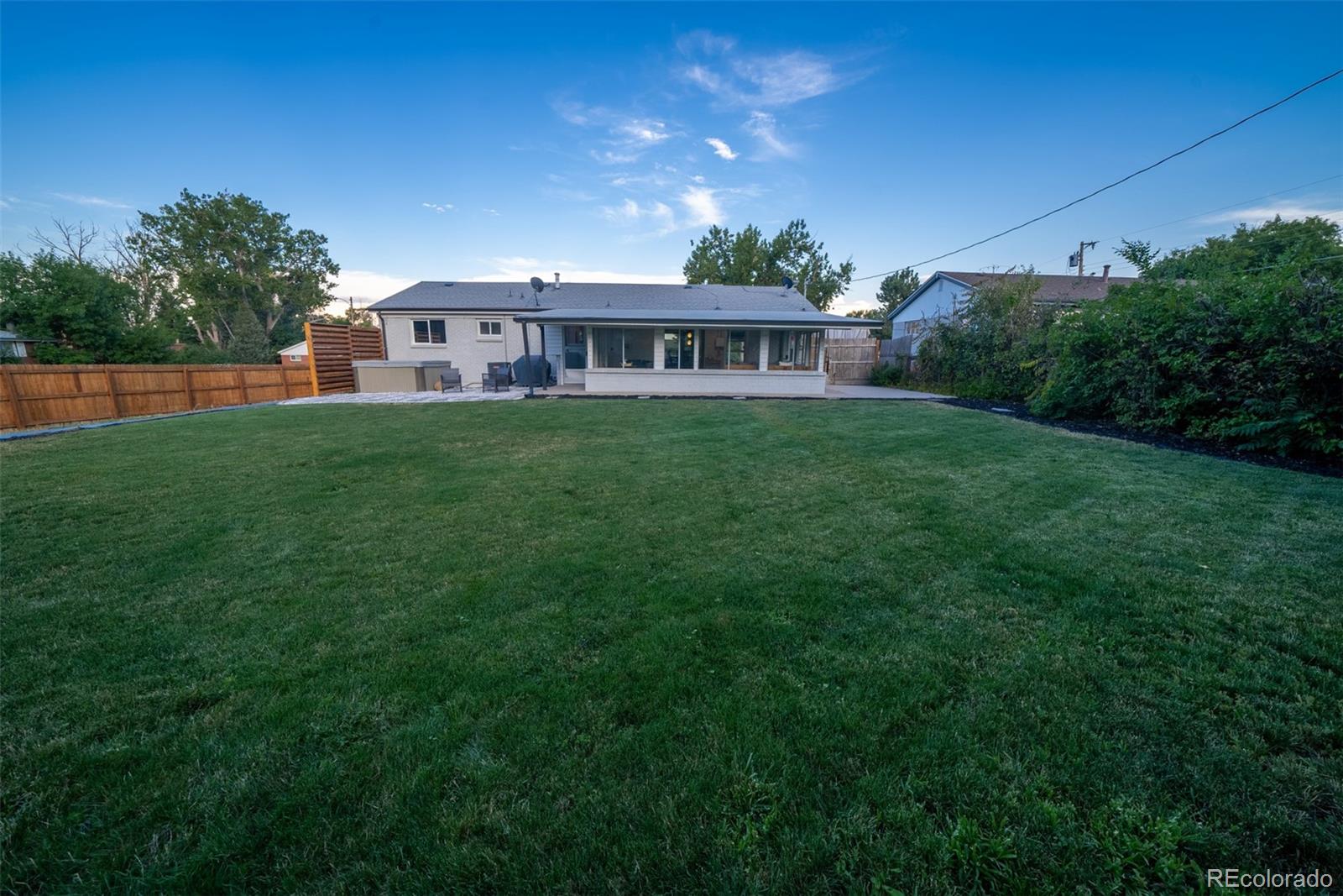 4947 South Perry Street Littleton, CO 80123 - Photo 20 of 24 a view of a house with backyard and garden