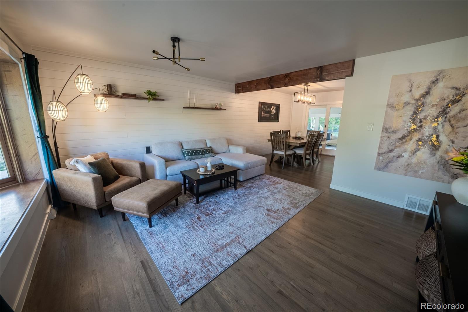 4947 South Perry Street Littleton, CO 80123 - Photo 2 of 24 a living room with furniture and a couch