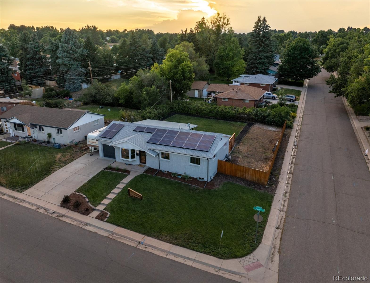 4947 South Perry Street Littleton, CO 80123 - Photo 22 of 24 an aerial view of a house with garden space and street view