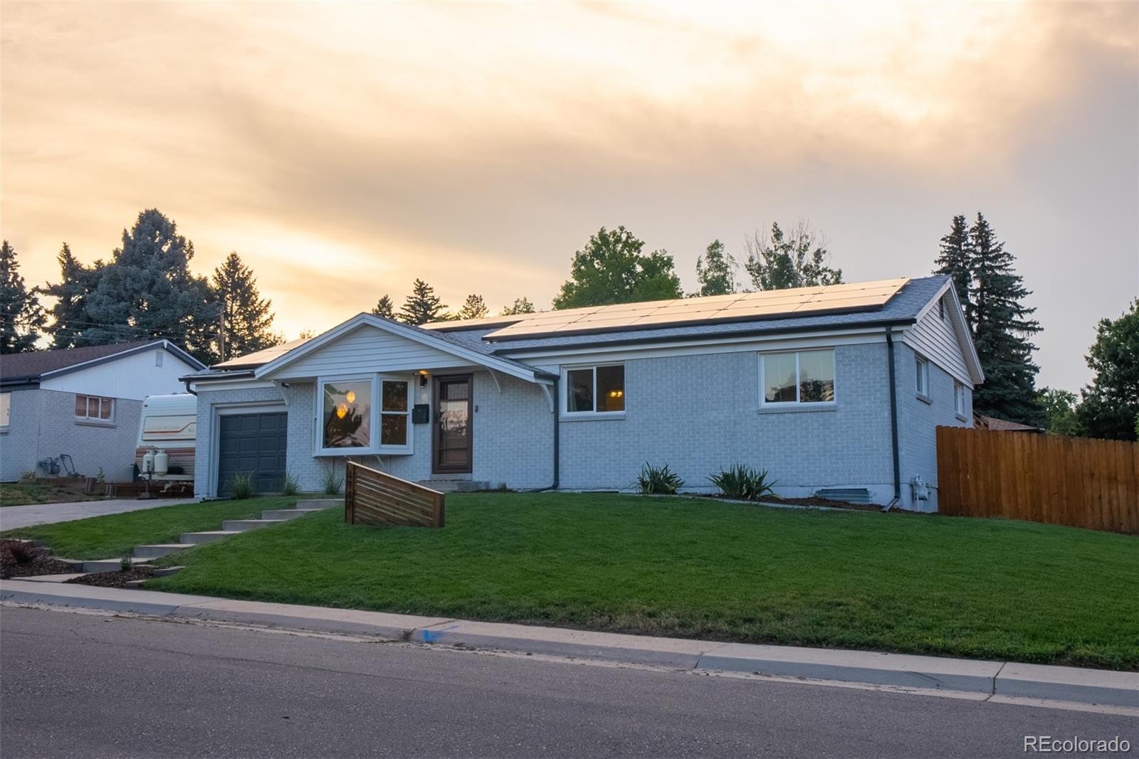 4947 South Perry Street Littleton, CO 80123 - Photo 23 of 24 a front view of house with yard and green space