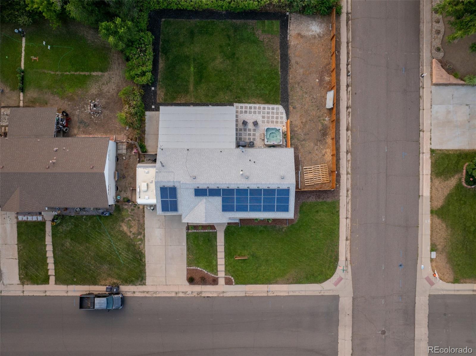 4947 South Perry Street Littleton, CO 80123 - Photo 24 of 24 an aerial view of a house with garden space and street view