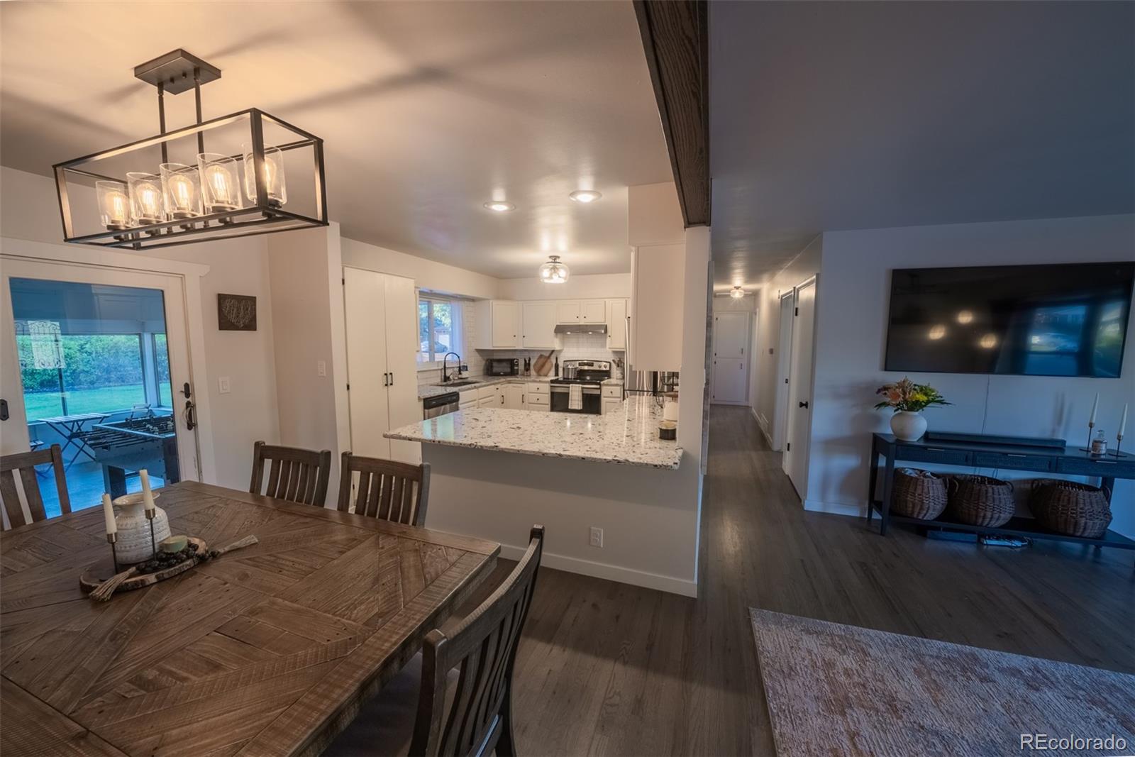 4947 South Perry Street Littleton, CO 80123 - Photo 4 of 24 a view of a dining room with furniture