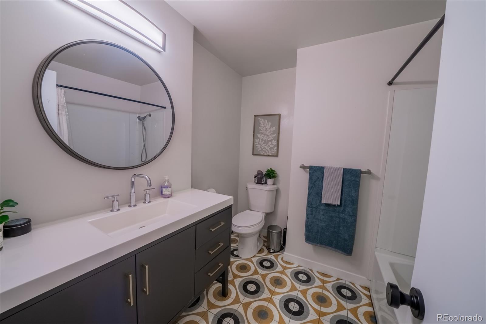 4947 South Perry Street Littleton, CO 80123 - Photo 9 of 24 a bathroom with a sink and a mirror