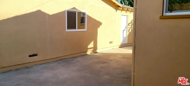 a view of a room with brick walls