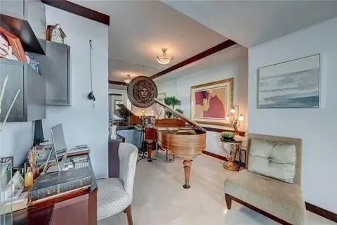 a living room with furniture and a clock