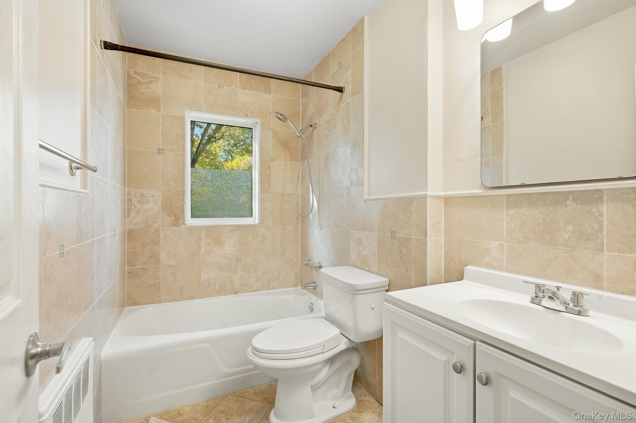 23 Young Place, Unit 2 Tuckahoe, NY 10707 - Photo 17 of 20 a bathroom with a sink a toilet and shower