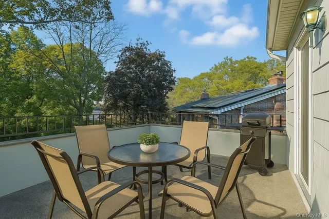 a view of a chairs and table in the patio