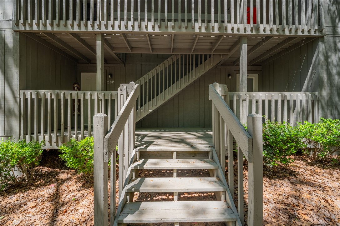 150 Ligon Street, Unit 2302 Clemson, SC 29631 - Photo 3 of 18 This multi-level entrance features wood railings, leading to an upper-level porch.