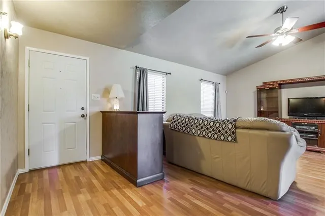 a living room with a couch and a flat screen tv