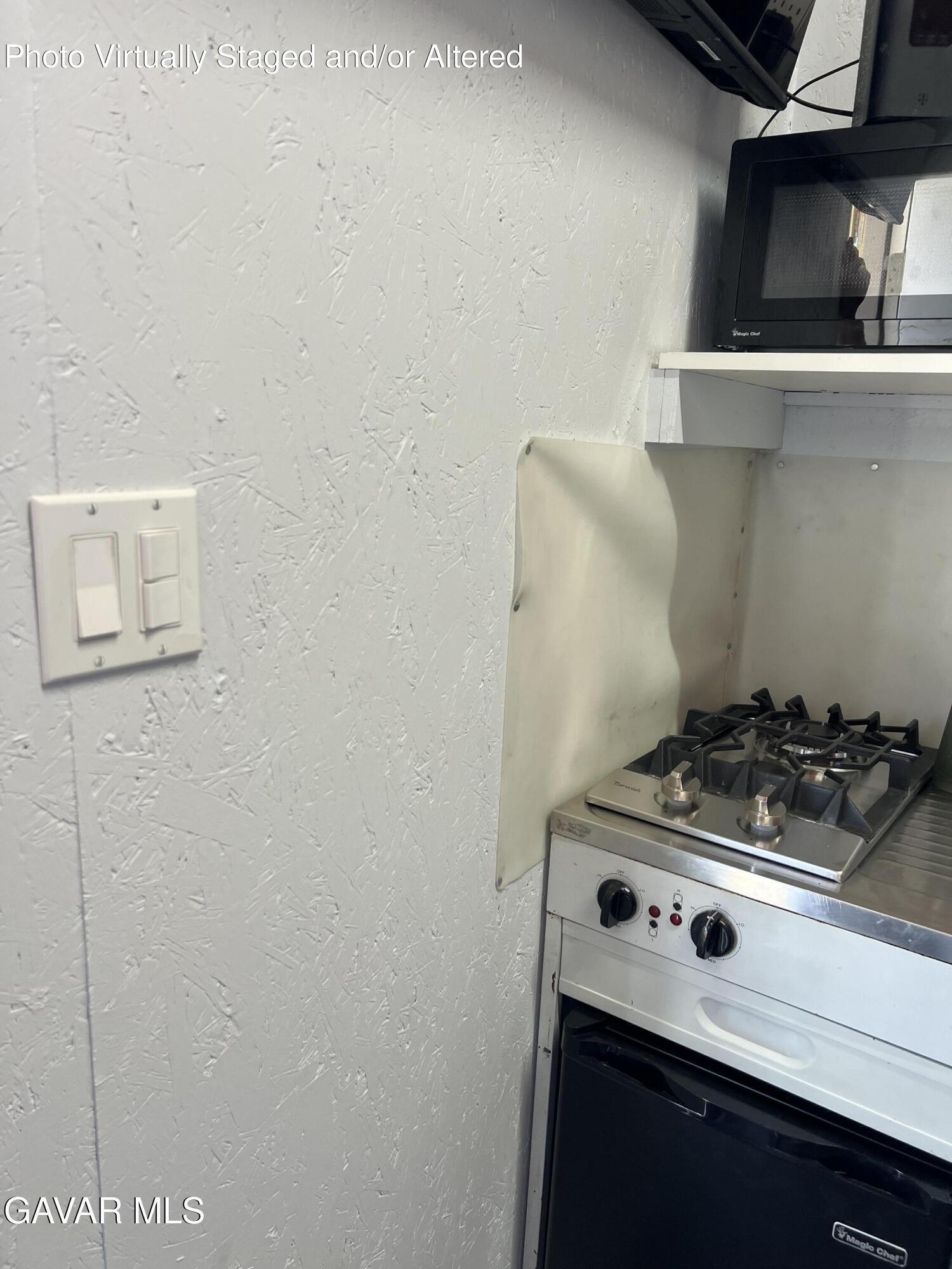 200 Ave Y/fort Tejon Road Llano, CA 93544 - Photo 14 of 30 a stove top oven sitting inside of a kitchen