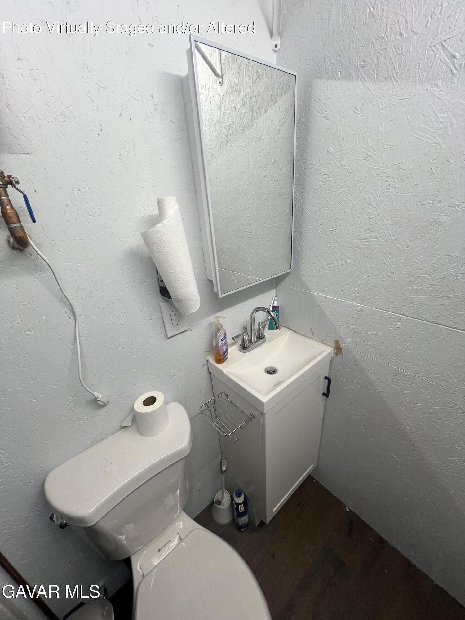 200 Ave Y/fort Tejon Road Llano, CA 93544 - Photo 16 of 30 a bathroom with a sink and mirror with toilet