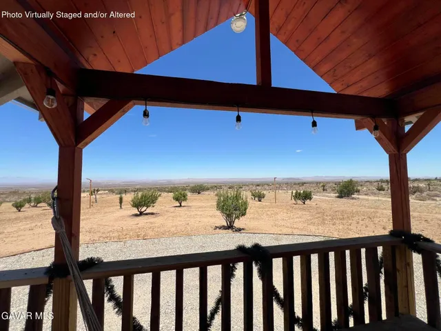 a view of a balcony with wooden fence