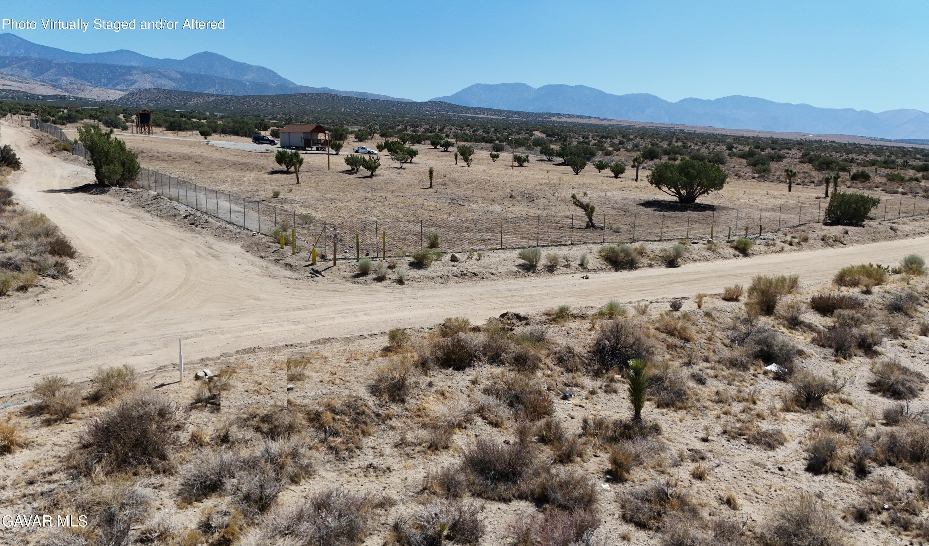 200 Ave Y/fort Tejon Road Llano, CA 93544 - Photo 23 of 30 a view of a town with mountains in the background