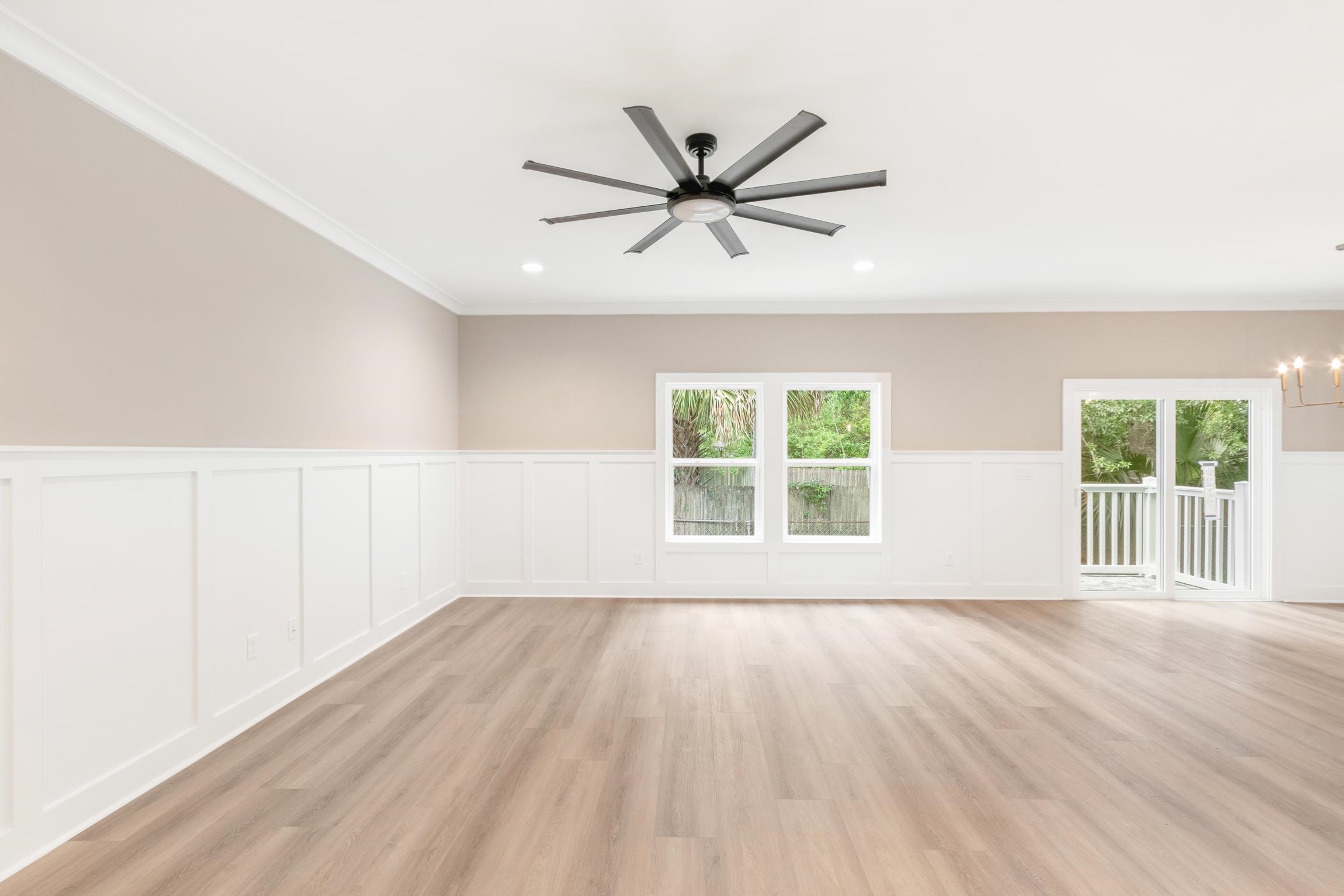 6334 Salado Road St. Augustine, FL 32080 - Photo 12 of 37 a view of an empty room with wooden floor and a window