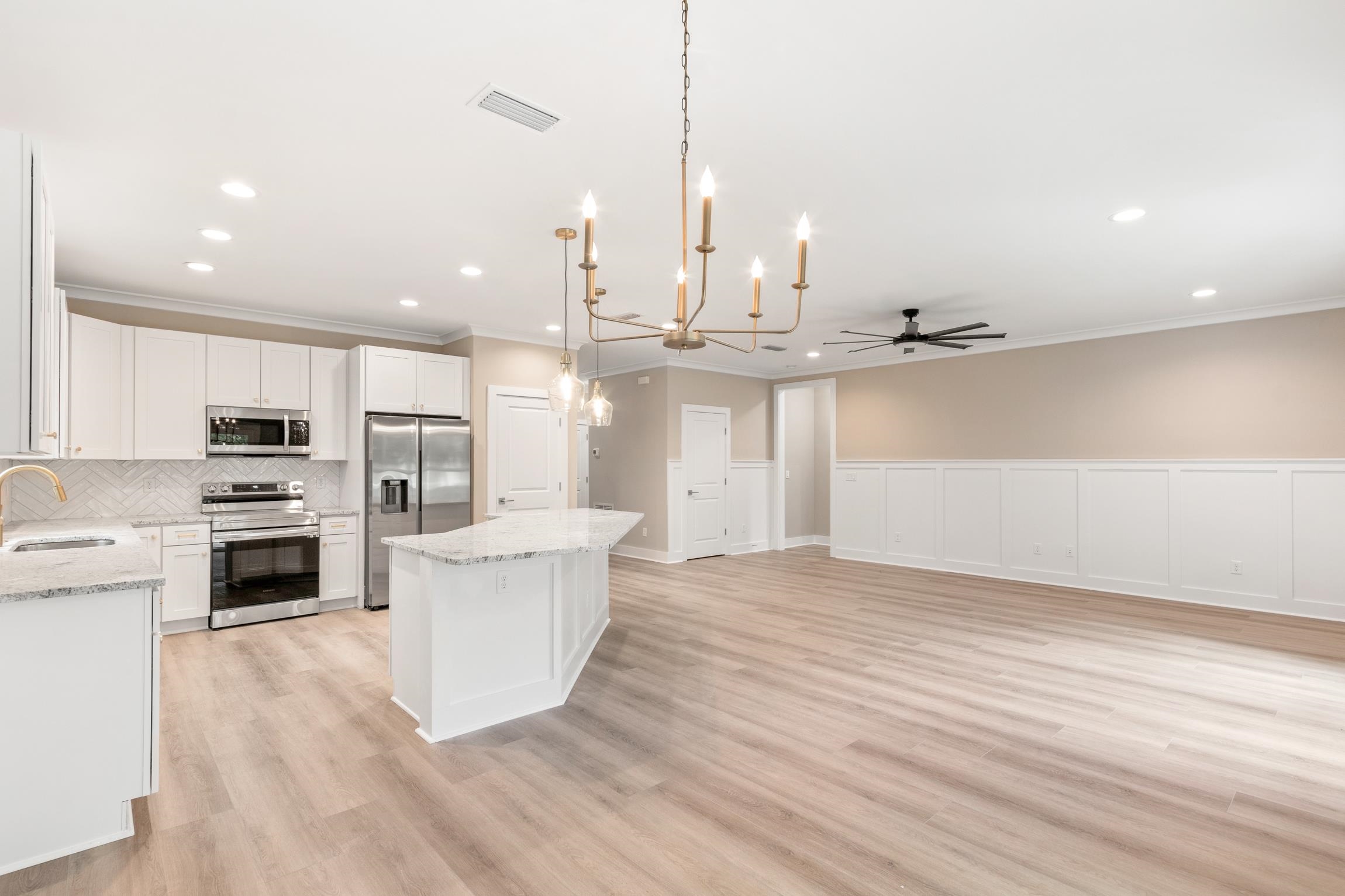 6334 Salado Road St. Augustine, FL 32080 - Photo 13 of 37 a kitchen with kitchen island a stove a sink and a refrigerator