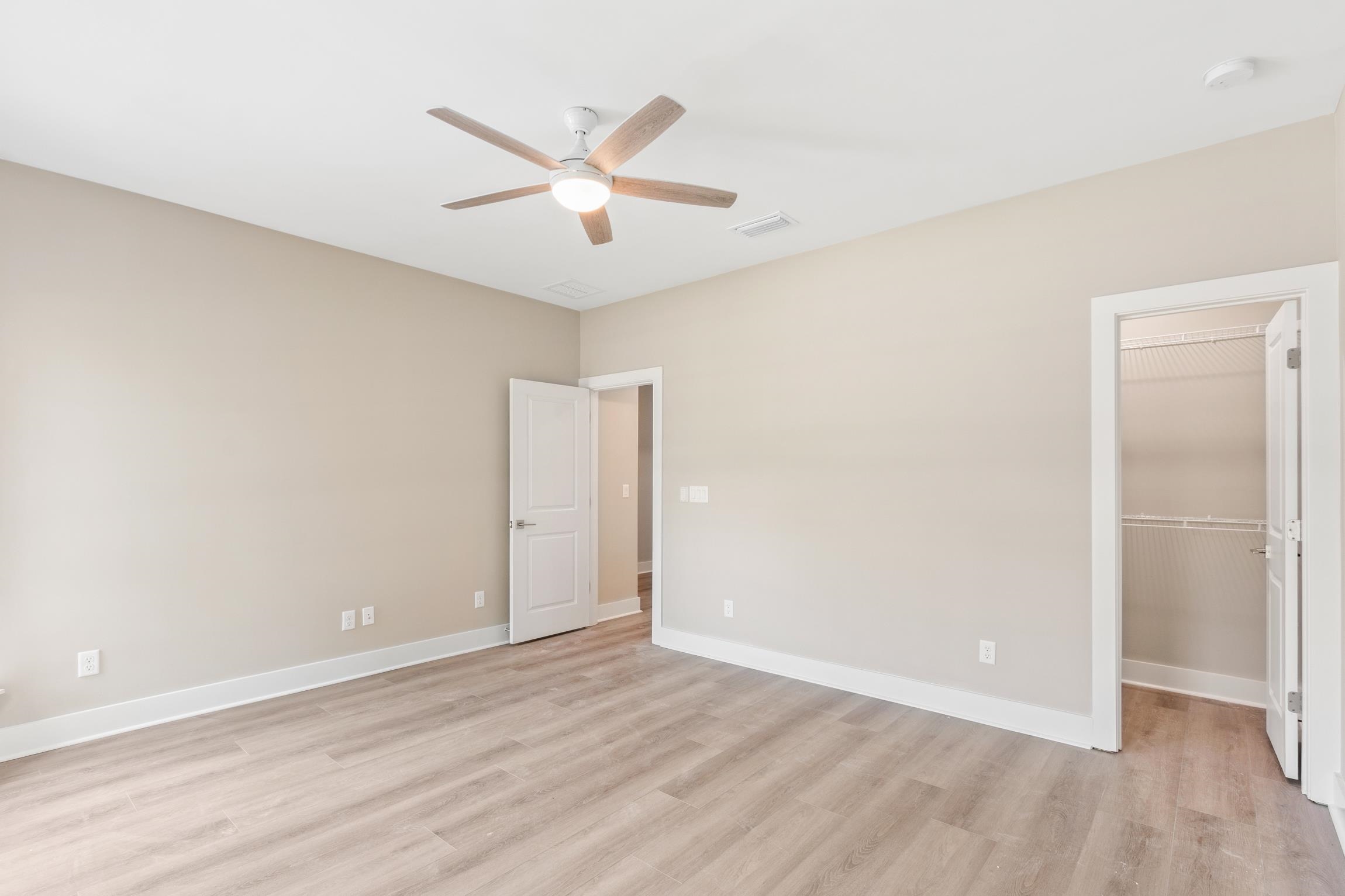 6334 Salado Road St. Augustine, FL 32080 - Photo 22 of 37 an empty room with wooden floor and windows