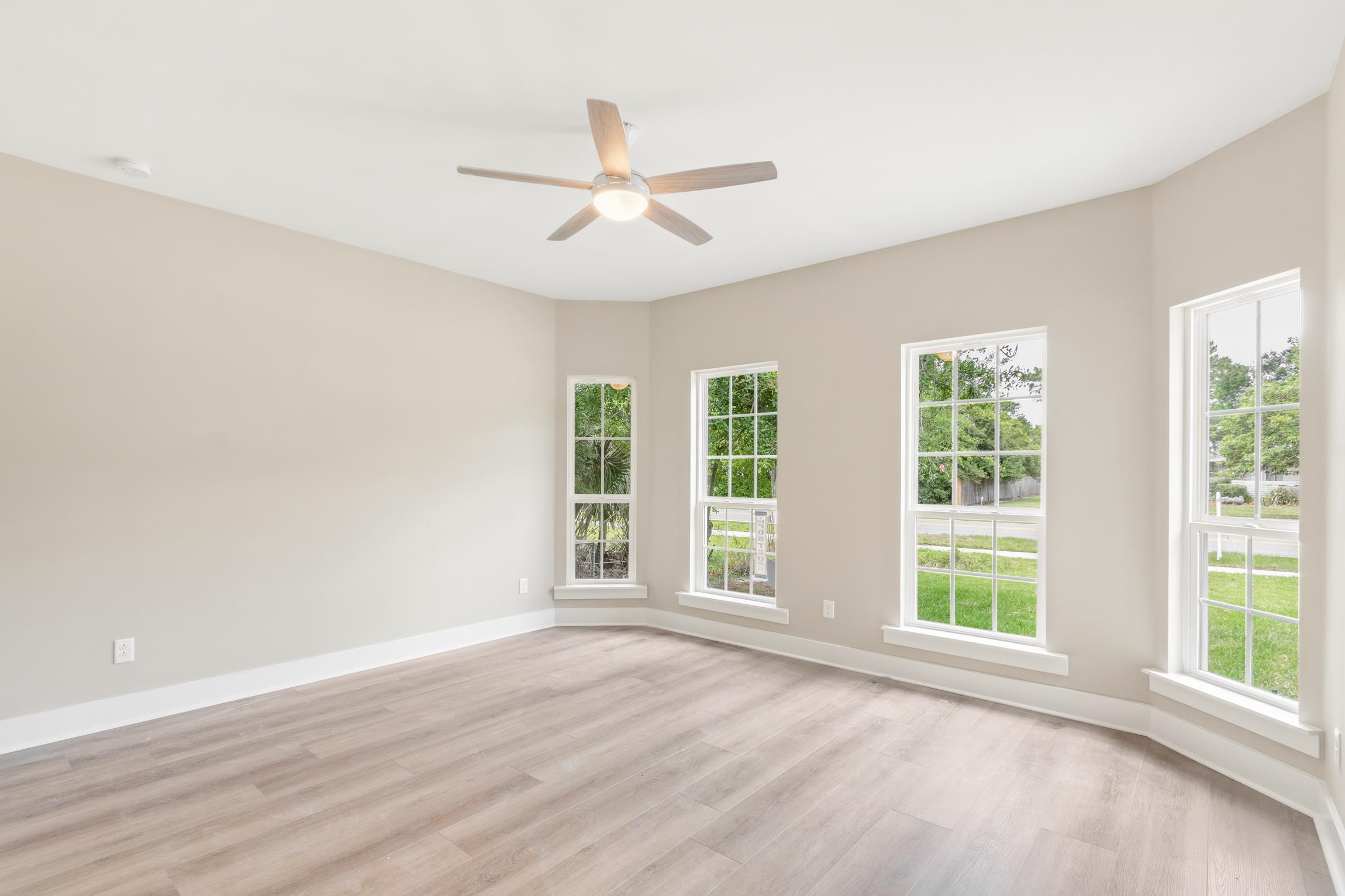 6334 Salado Road St. Augustine, FL 32080 - Photo 26 of 37 a view of an empty room with wooden floor and a window