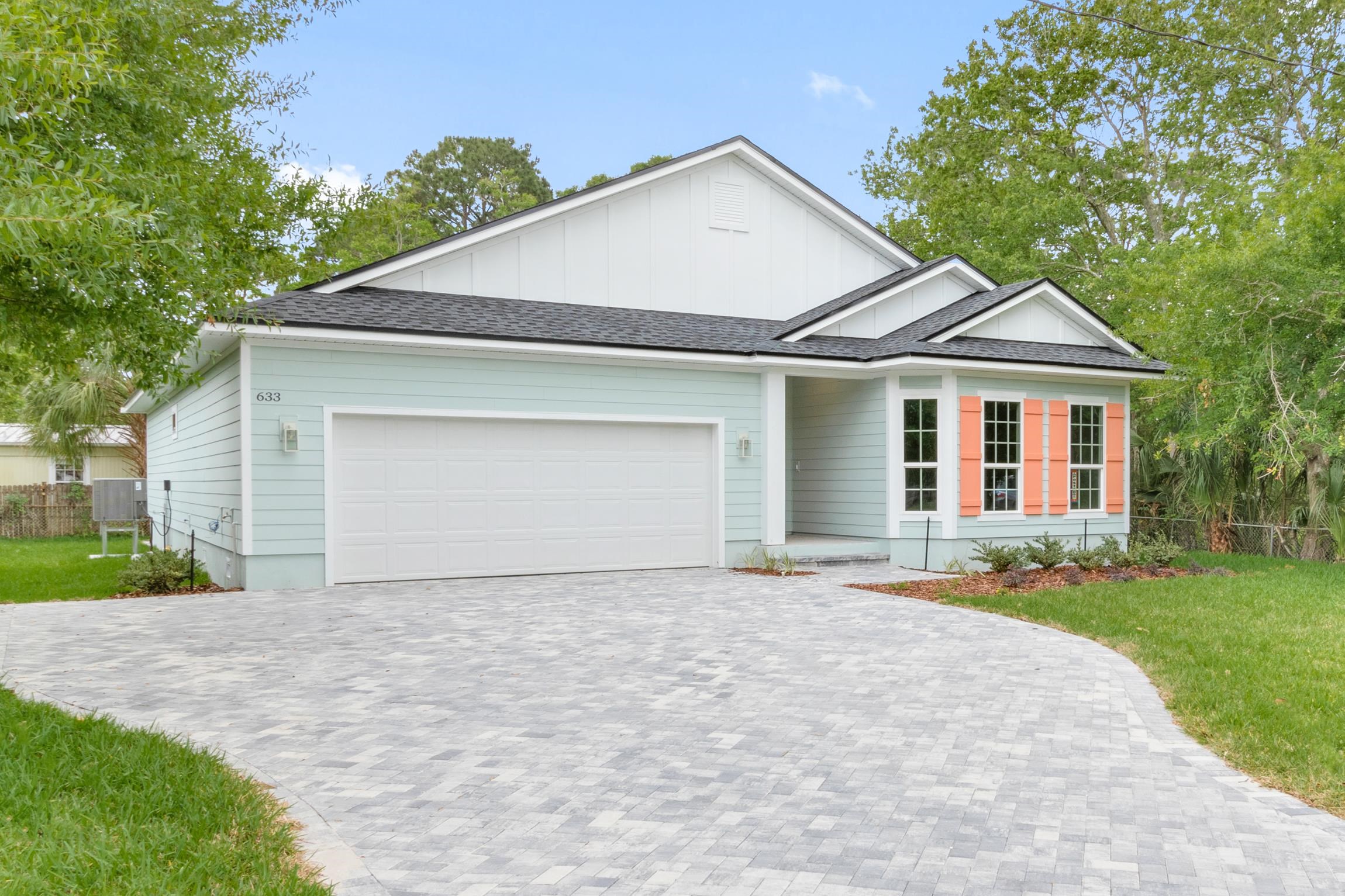 6334 Salado Road St. Augustine, FL 32080 - Photo 29 of 37 a front view of a house with a yard and garage
