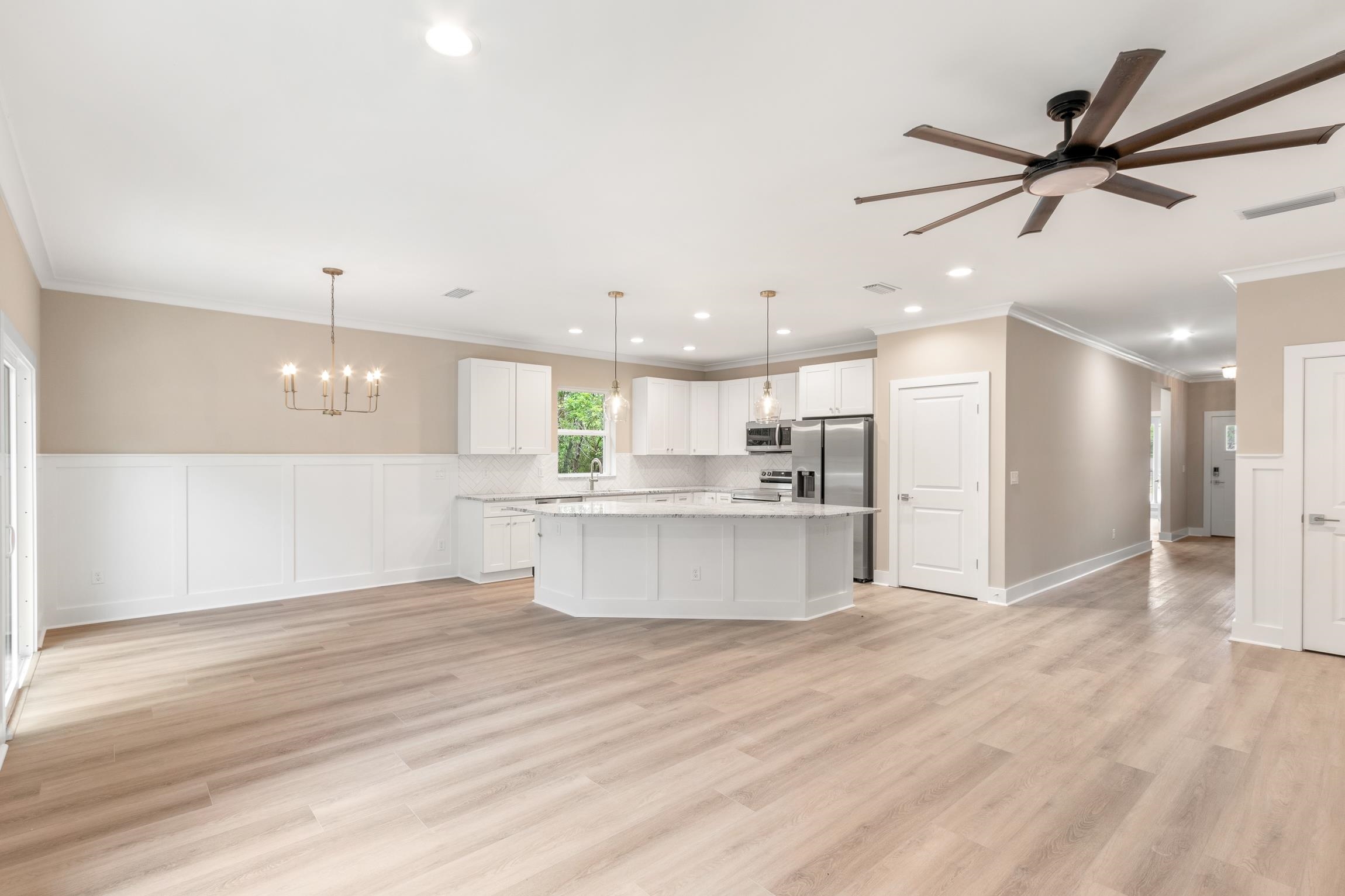 6334 Salado Road St. Augustine, FL 32080 - Photo 6 of 37 a view of kitchen with kitchen island white cabinets and stainless steel appliances