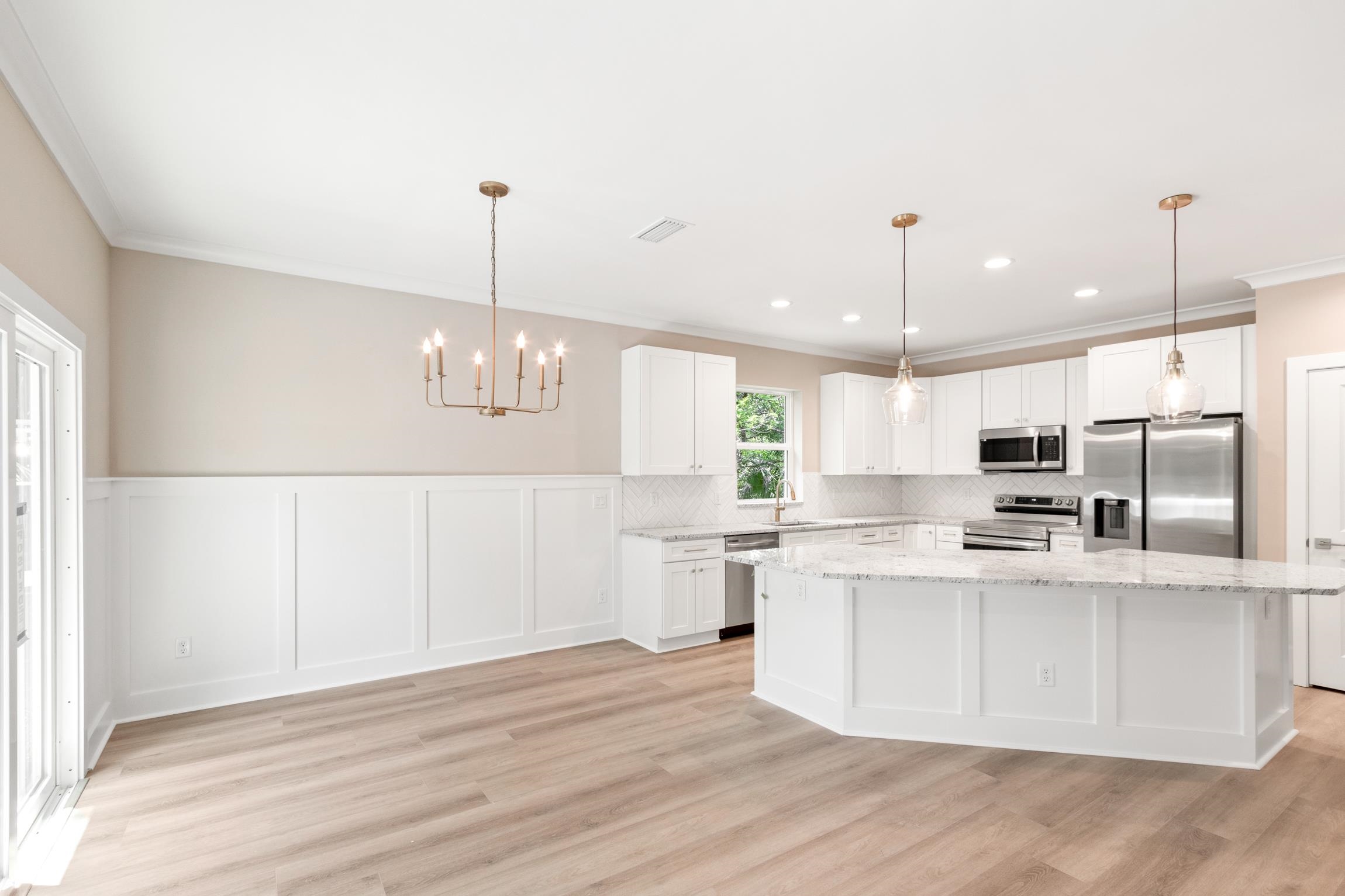 6334 Salado Road St. Augustine, FL 32080 - Photo 7 of 37 a kitchen with stainless steel appliances a refrigerator sink and microwave