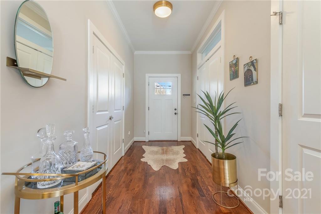 300 Mill Road Charlotte, NC 28216 - Photo 4 of 31 a view of a dining room with furniture and wooden floor