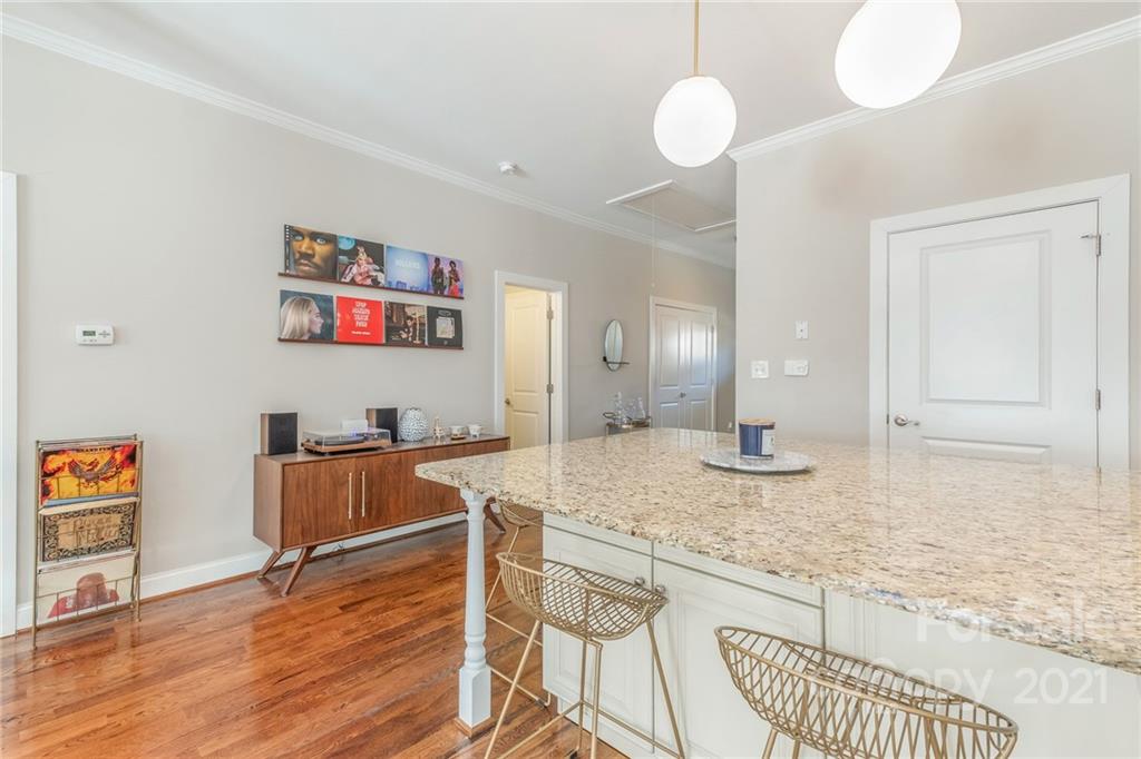 300 Mill Road Charlotte, NC 28216 - Photo 8 of 31 a view of a kitchen area with granite countertop wooden floor